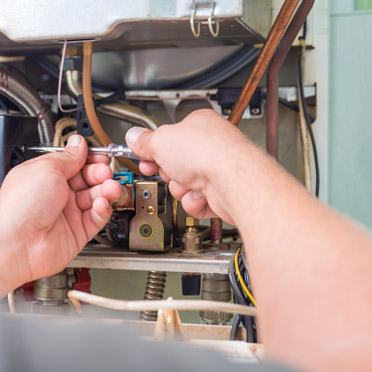 Technician conducting HVAC maintenance in Los Angeles.